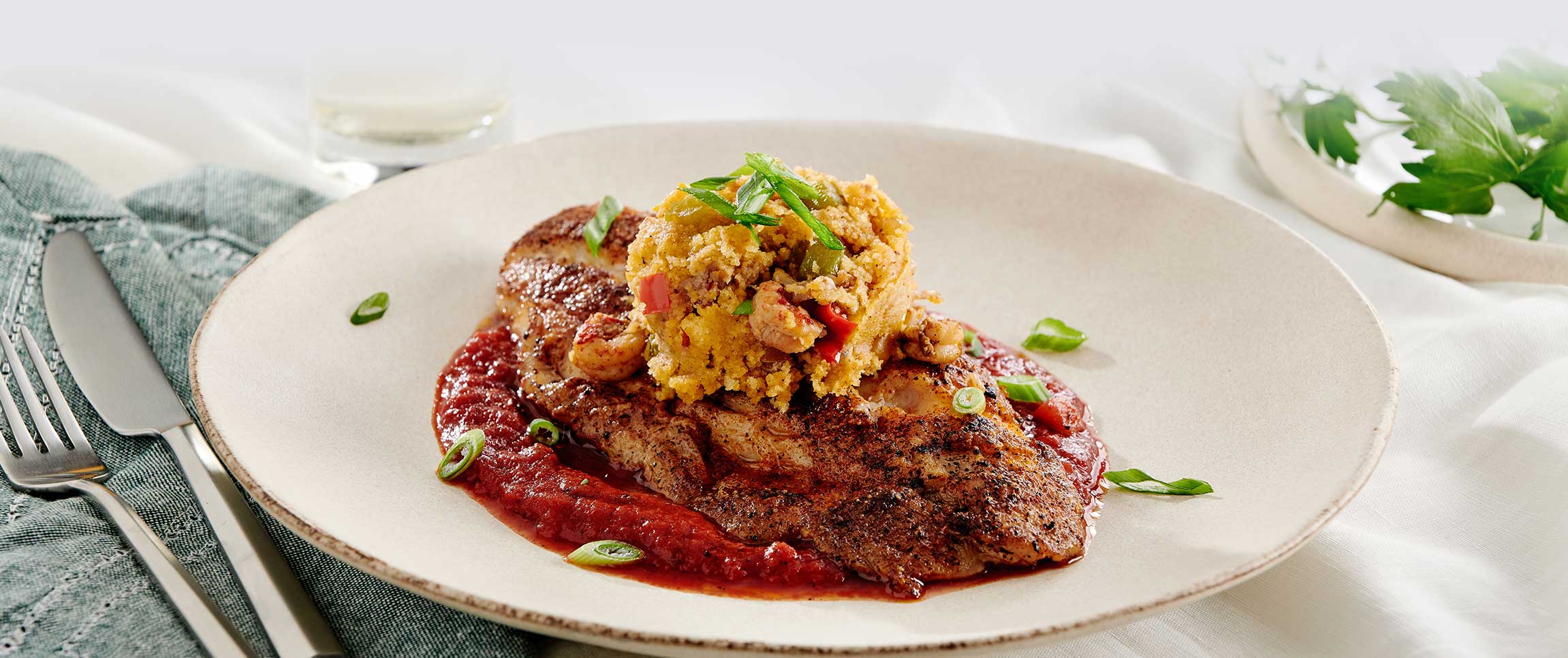 Blackened Redfish with Crawfish Cornbread Dressing and Tabasco Tomatoes