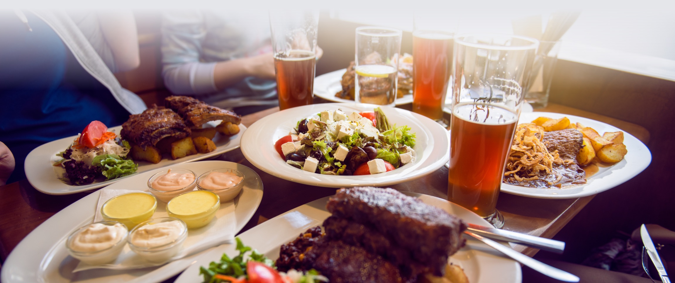 Full Dinner Table with Beer Glasses