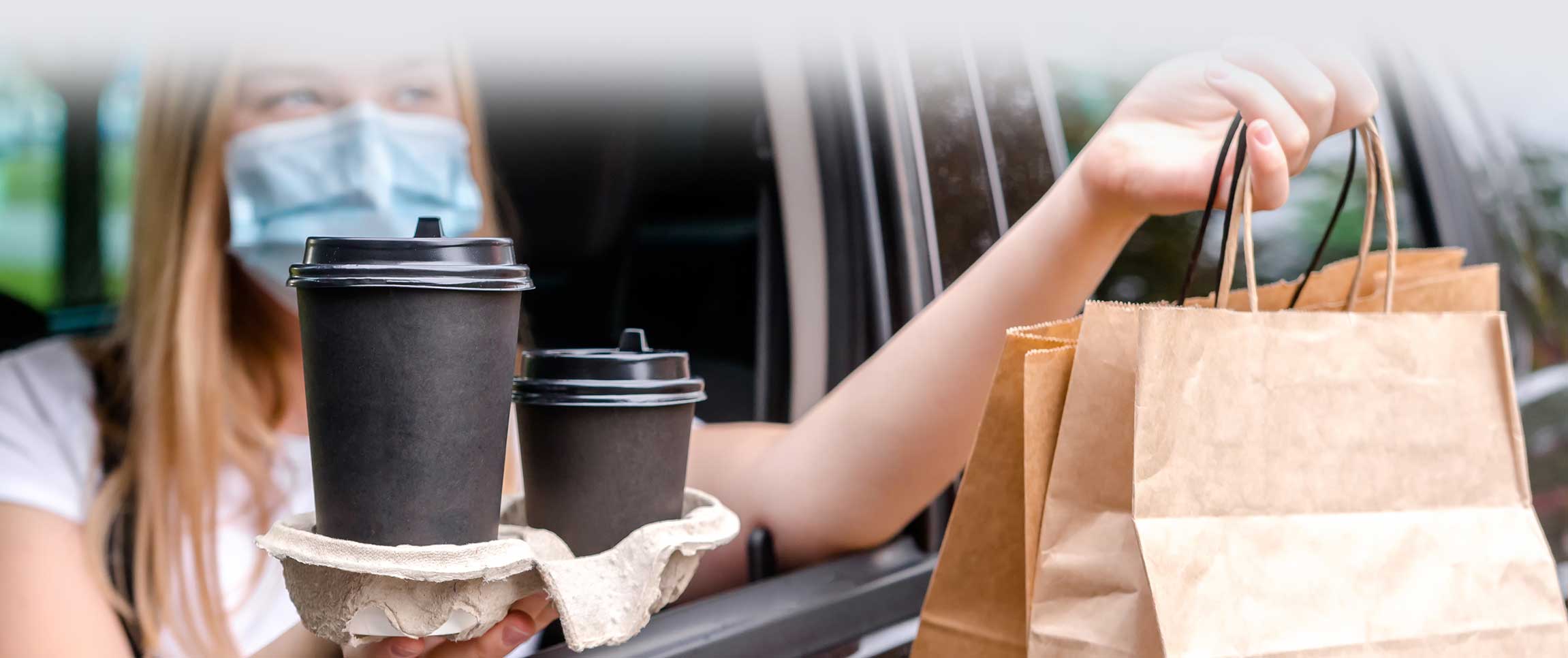 Woman Taking Food Delivery from the Car