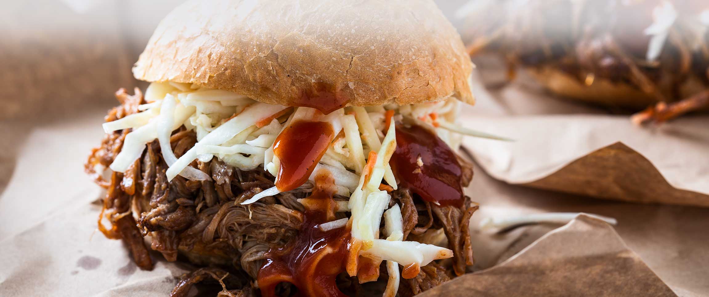 Pulled pork sandwich with cabbage slaw on top