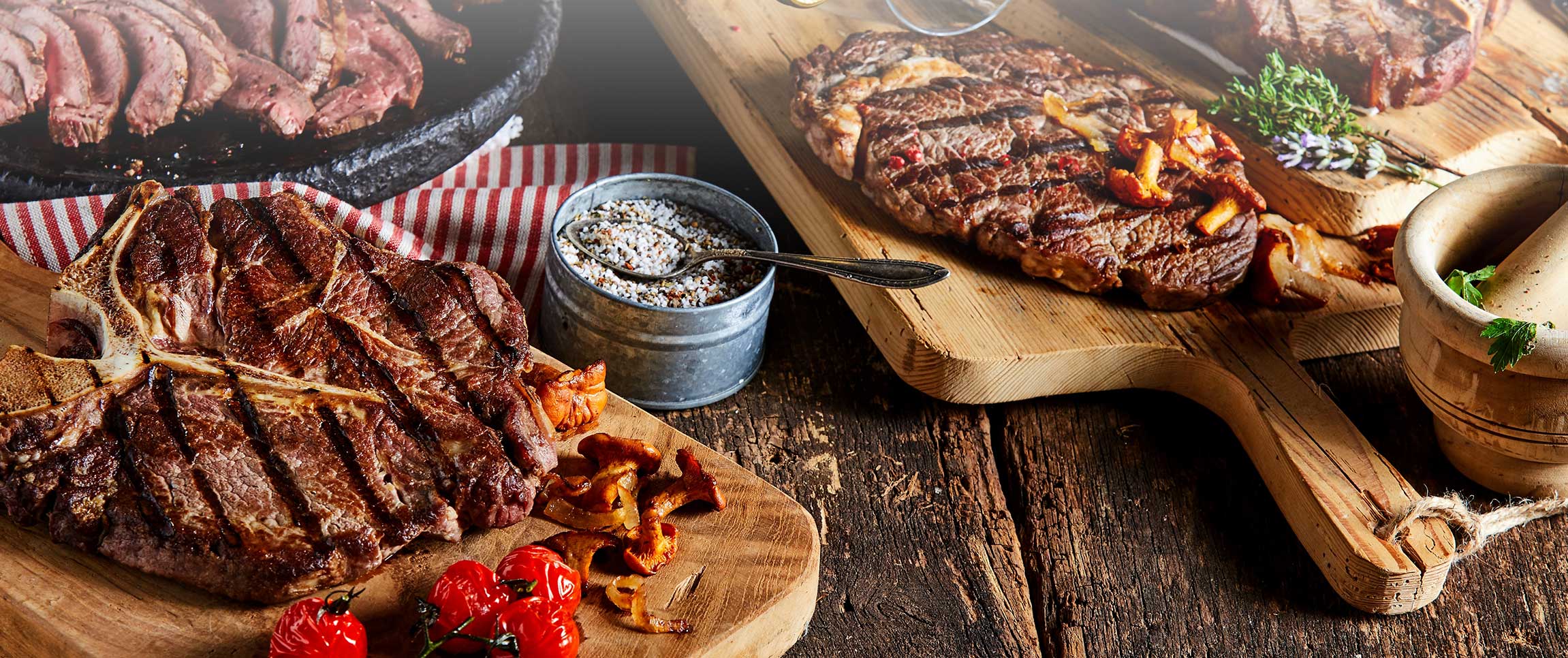 Cooked meat variety on cutting boards