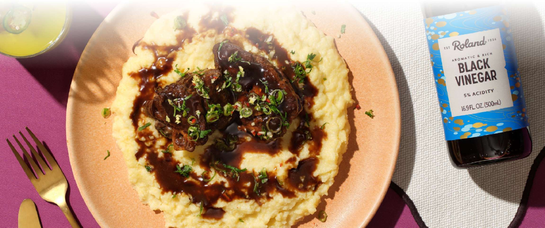 Black Vinegar Braised Osso Bucco Over Polenta with Herb Gremolata