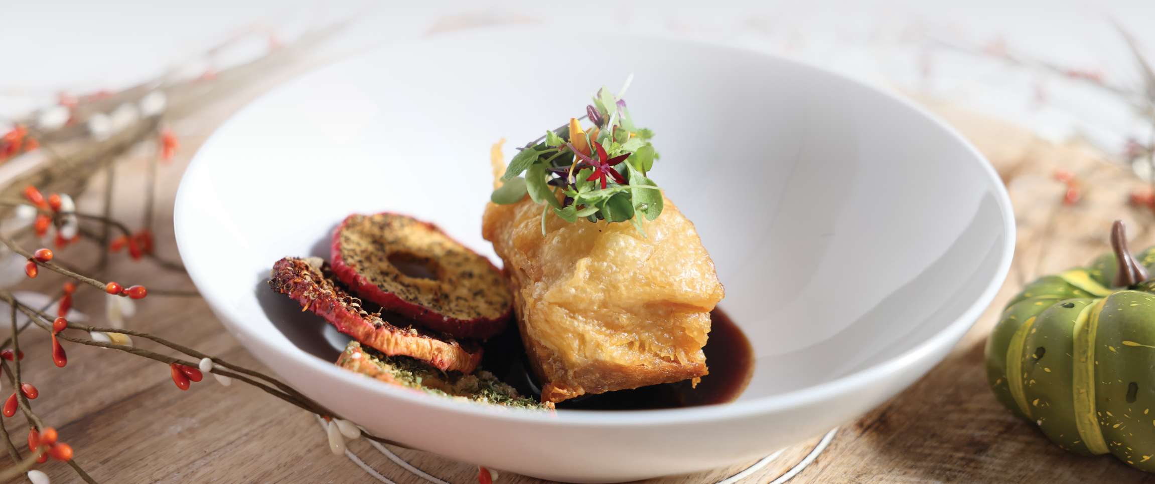 Crispy Allegiance® Pork Belly with Molasses Whiskey Sauce and Magellan® Apple Rings