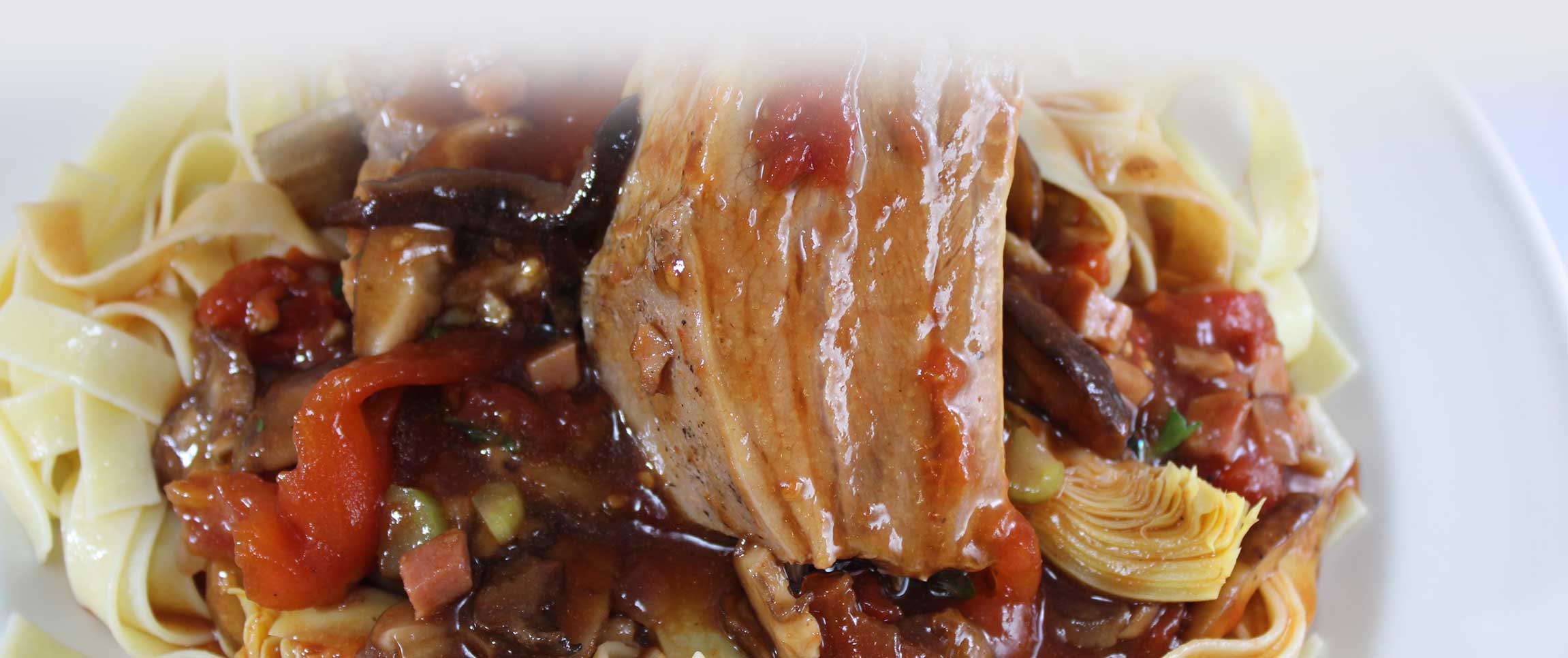 Veal Short Ribs Hunter Style atop pasta