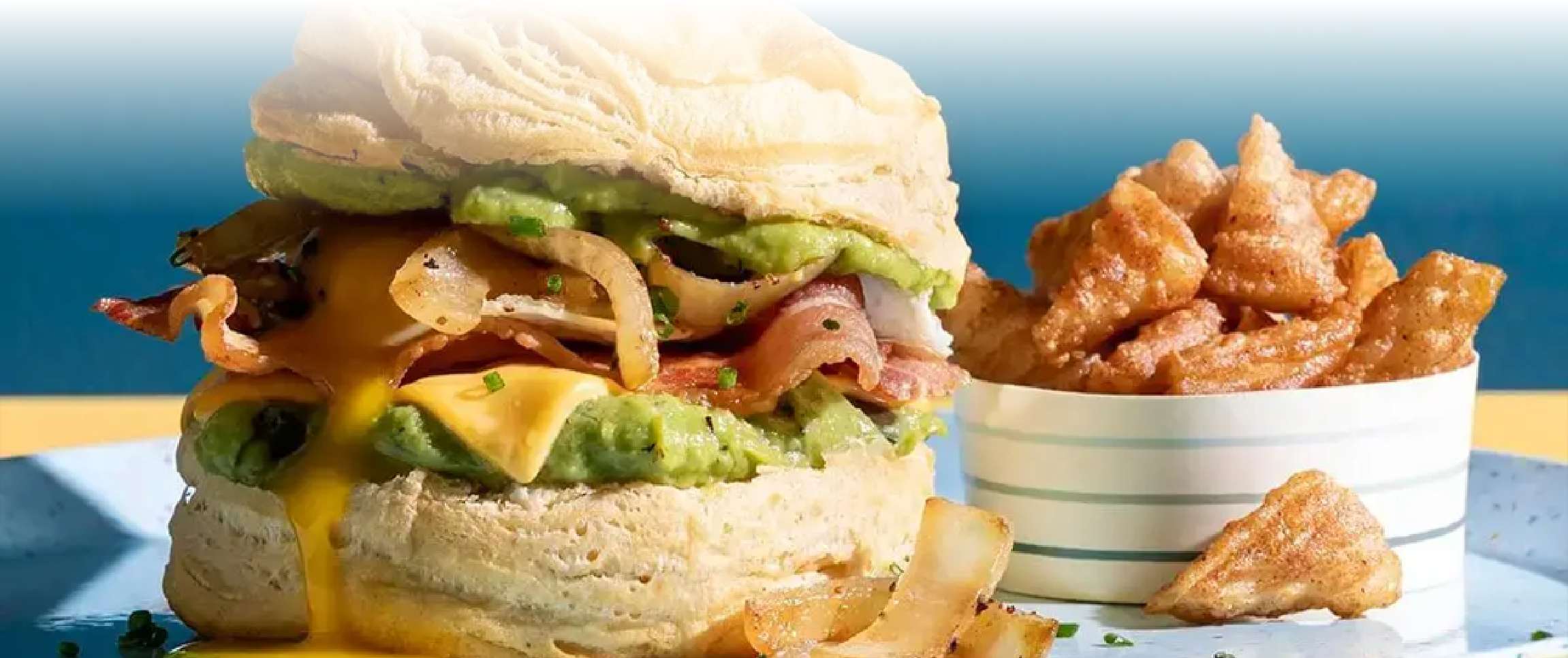 Bacon, Egg and Cheddar Caramelized Onion Biscuit Sandwich