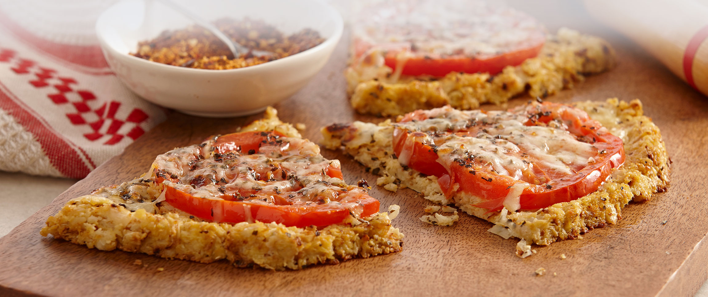 Thin Cauliflower Almond Crusted Tomato Pizza