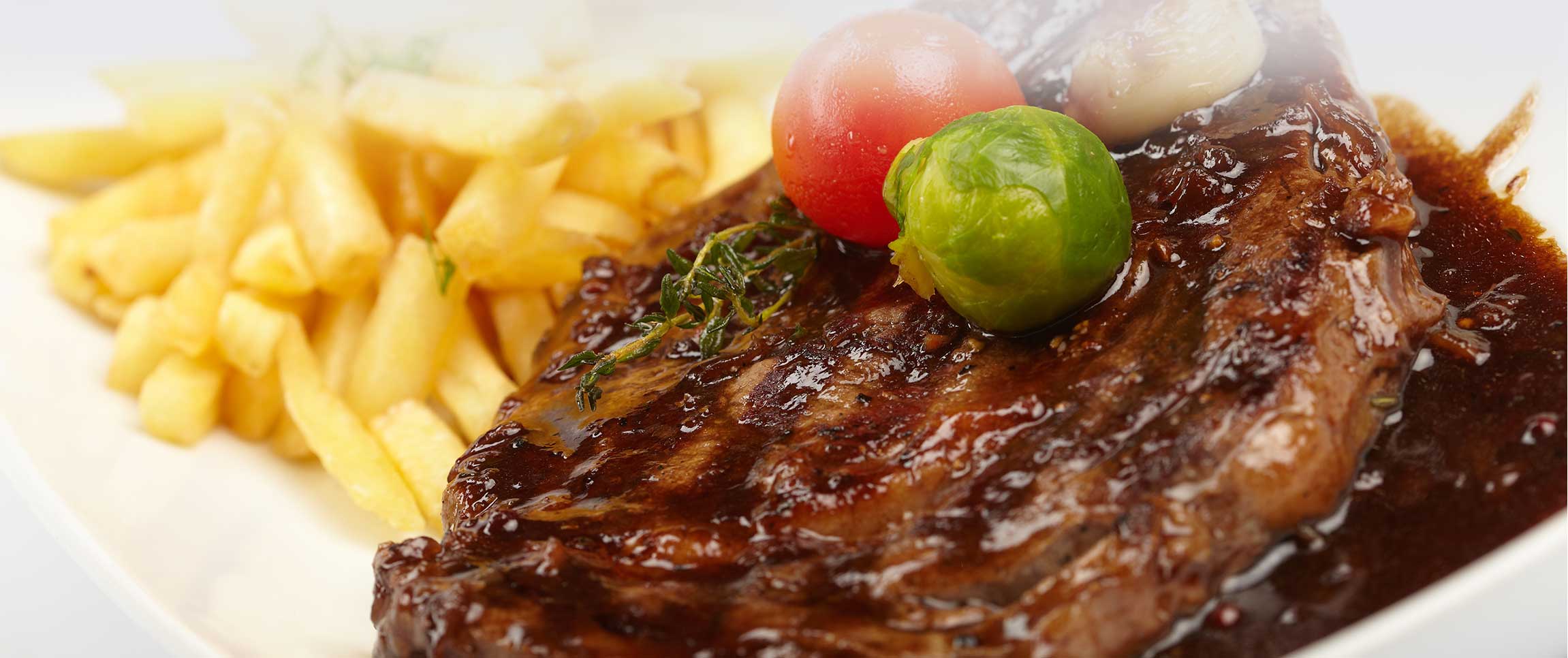 Braveheart Beef Ribeye with Hunter's Sauce and French Fries