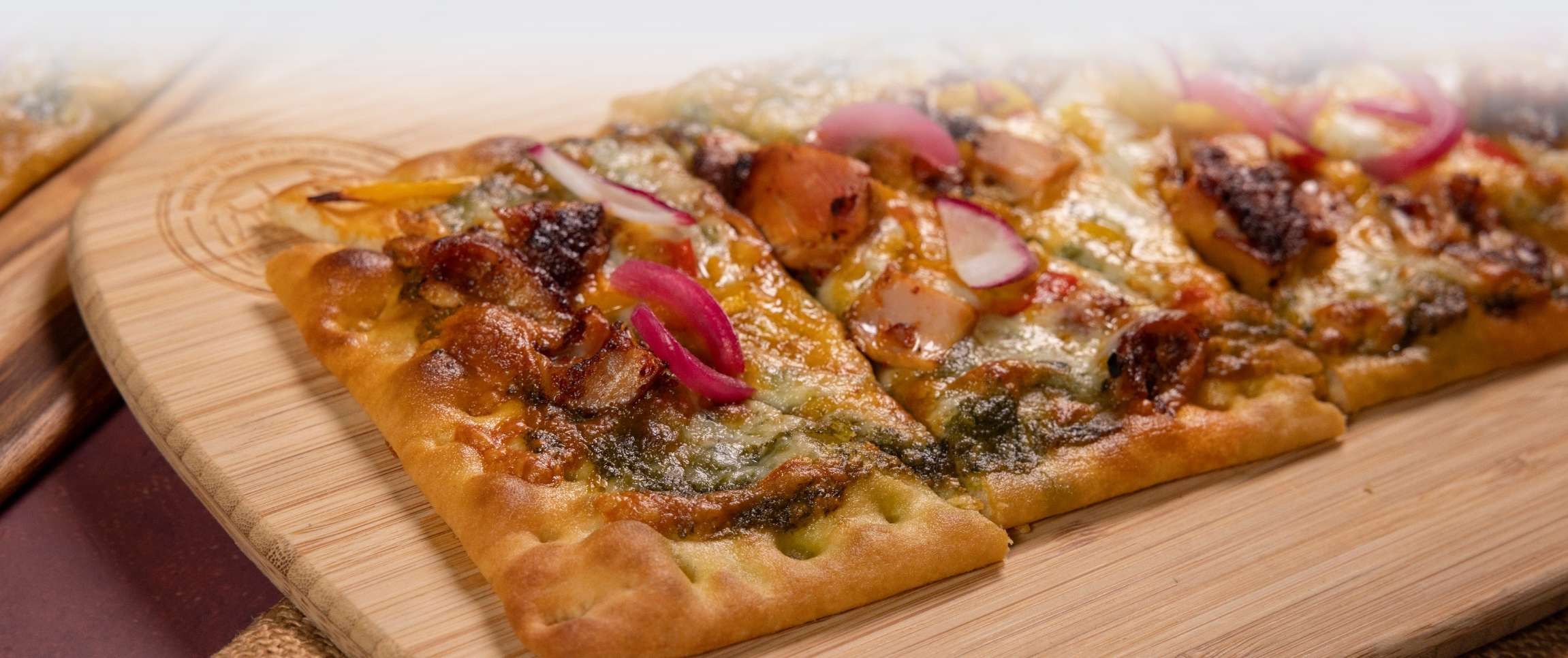 Adobo Rubbed Grilled Chicken Flatbread with Cilantro-Cotija Pesto 