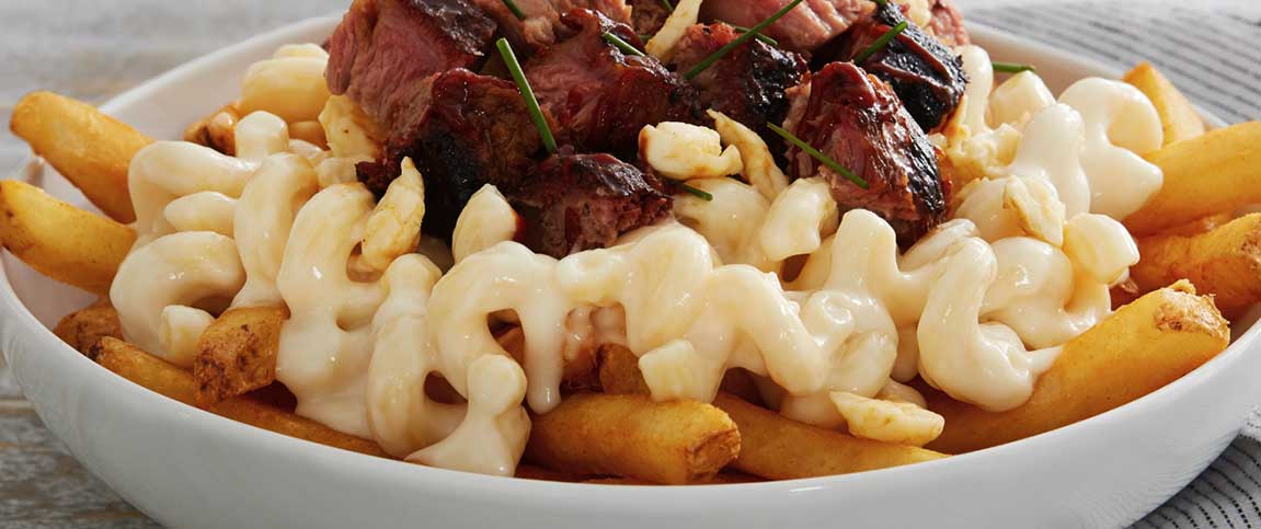 Fries Topped with Beef and Mac and Cheese