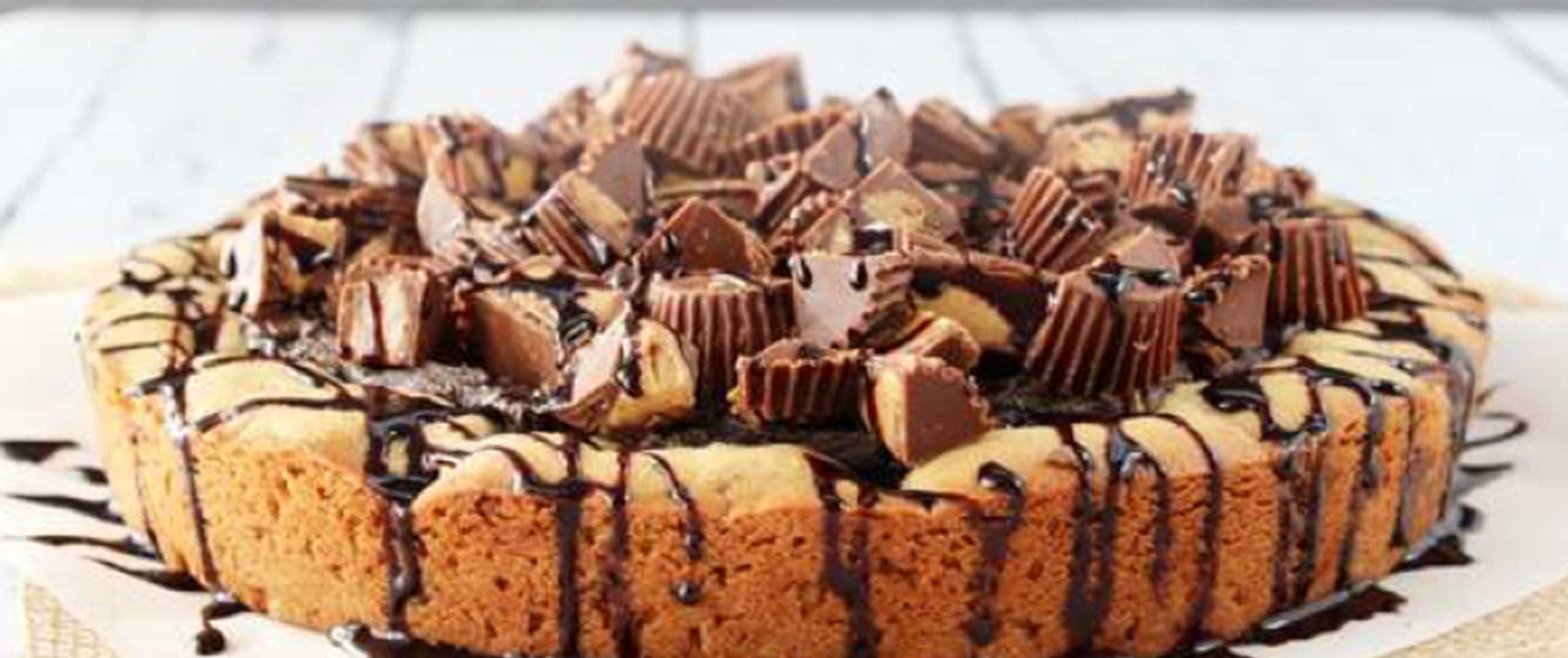 Chocolate Chip Cookie Pizza Topped with Reeses Pieces