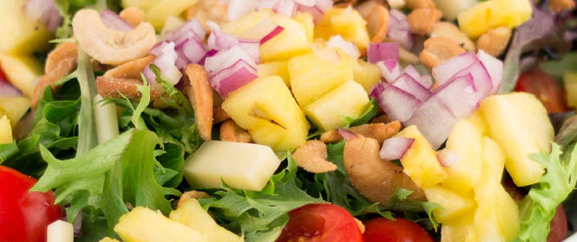Salad Topped with Fresh Pineapple and Cashews