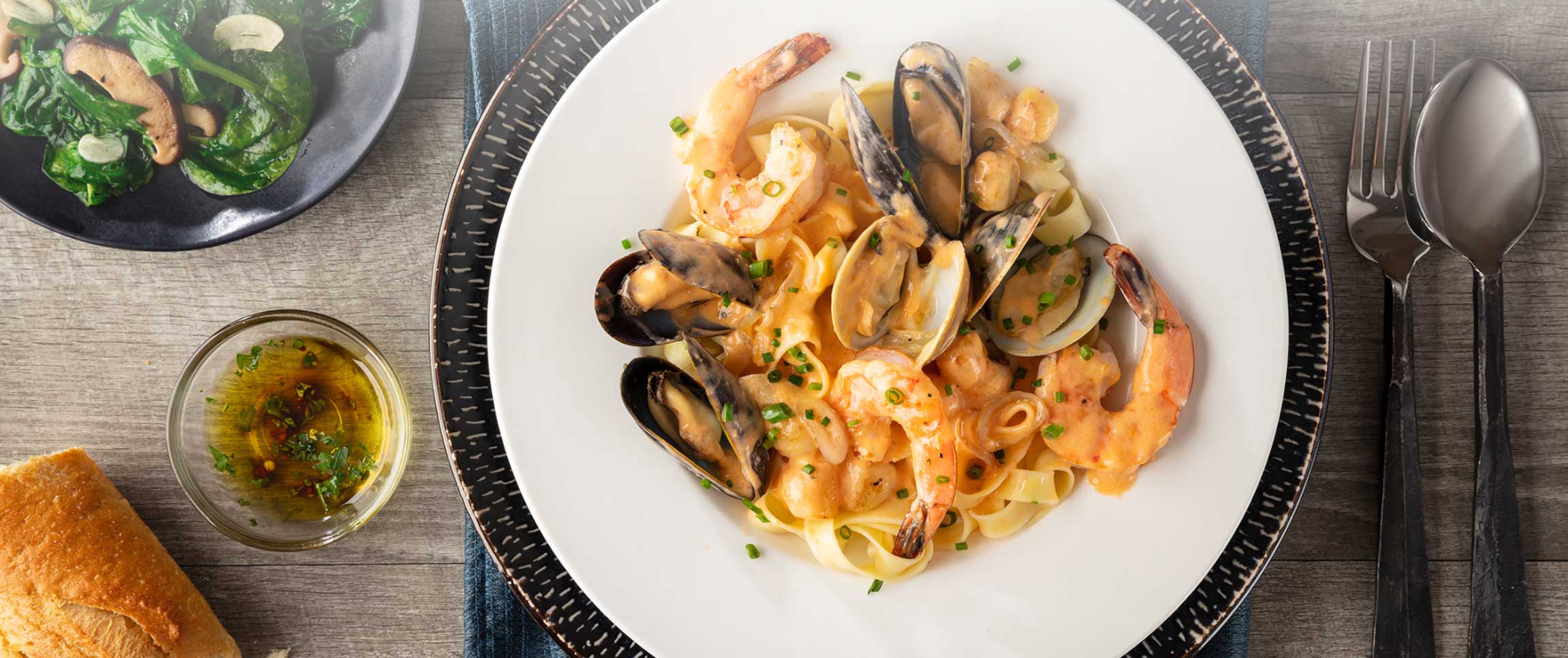 Seafood Fettuccine on a white plate