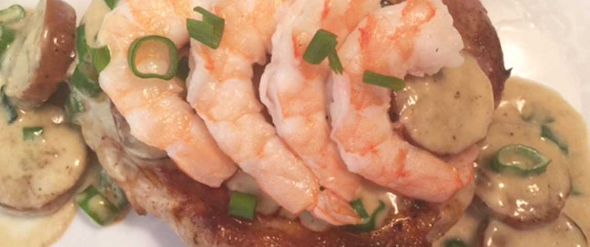 Porterhouse Pork Steak with Andouille Sauce and Shrimp