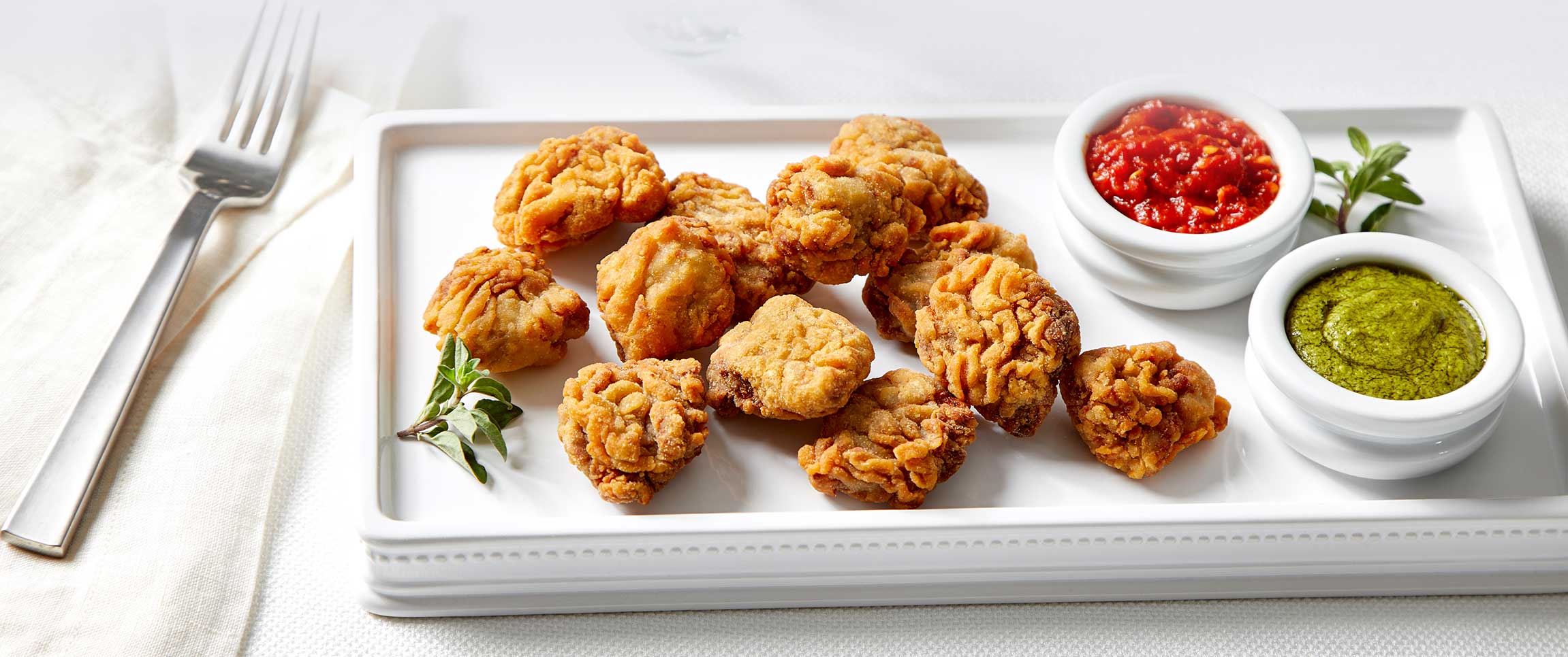 BRAVEHEART STEAK BITES W/ LUIGI ARRABBIATA SAUCE & ROMA PESTO CREAM 