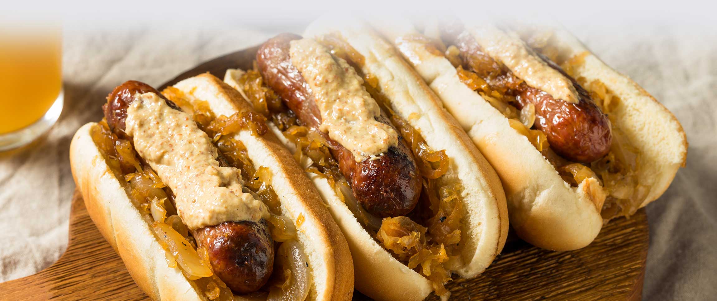 Brat with Bourbon Onions and Grain Mustard