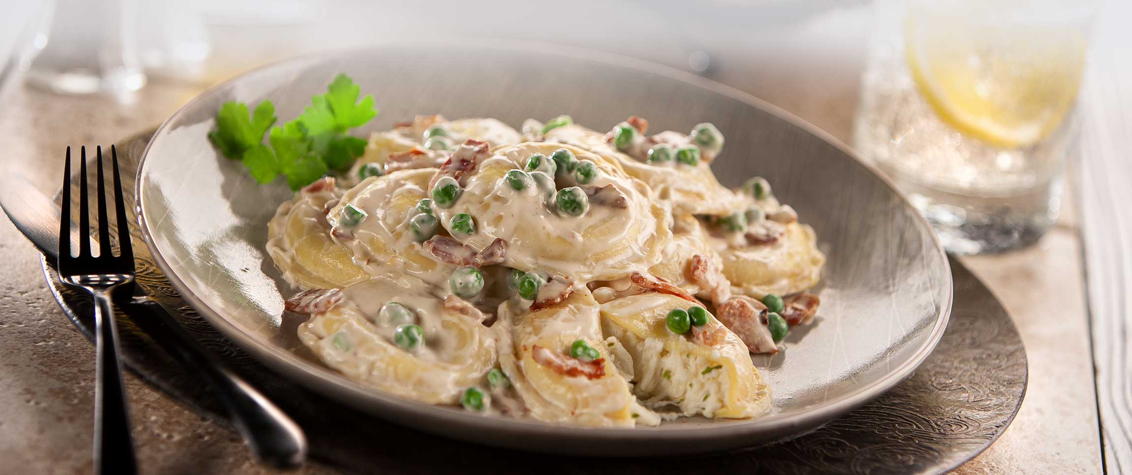 Cheese Ravioli with Bacon, Peas & Creamy Garlic Alfredo Sauce