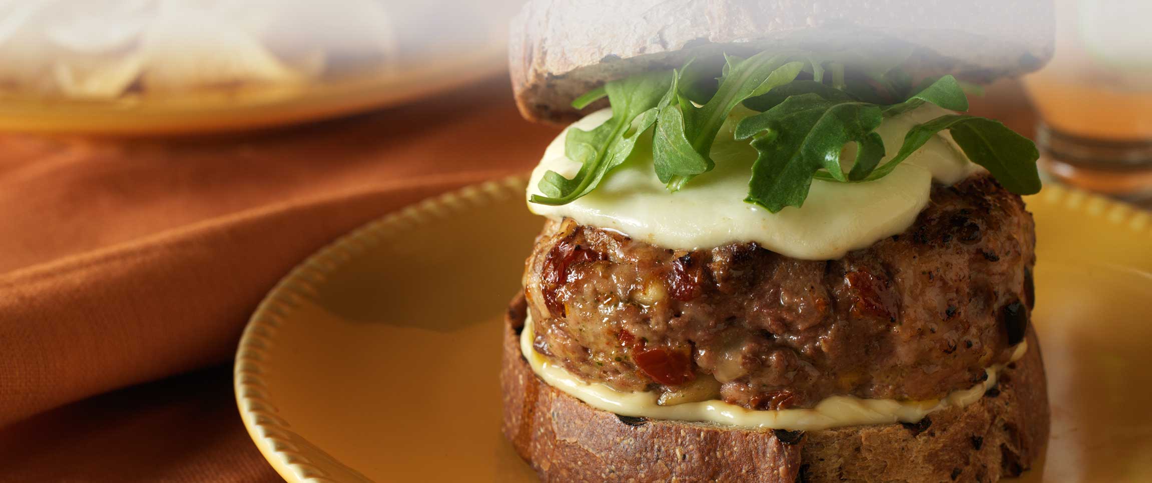 Pesto Burger with Sun Dried Tomato, Dry Jack  and Fresh Mozzarella 