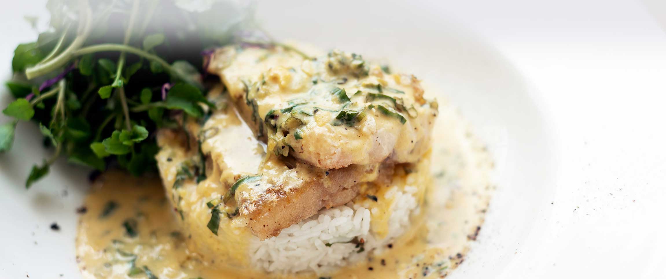 Bay Winds Chilean Sea Bass pan seared accompanied by Natures Best Saffron Cream