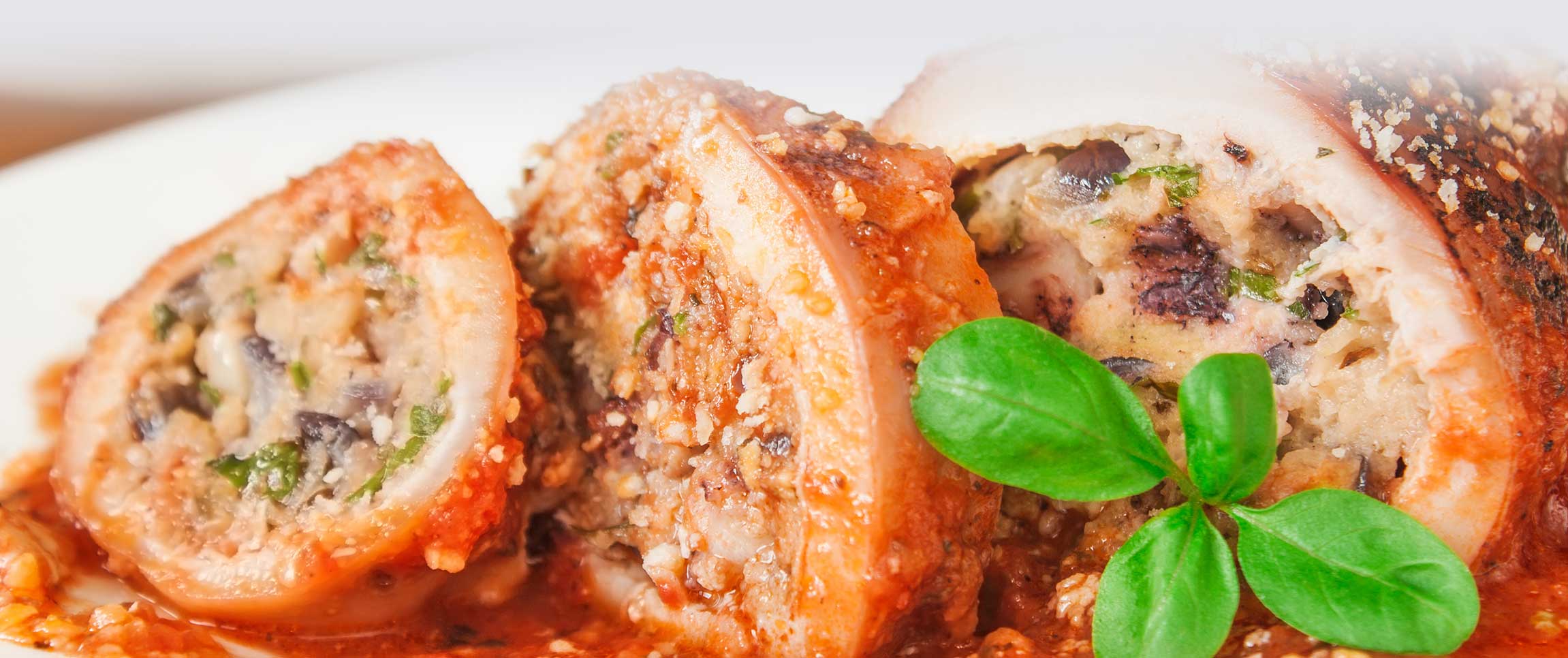 Tomato Braised Calimari with Sausage Stuffing