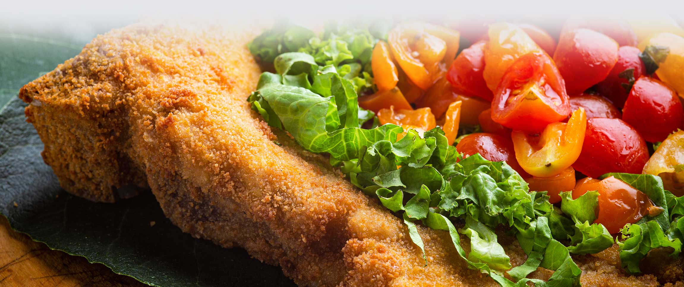 Piancone Epicurio Veal Chop with Parmesan Crust and Balsamic Candied Tomatoes