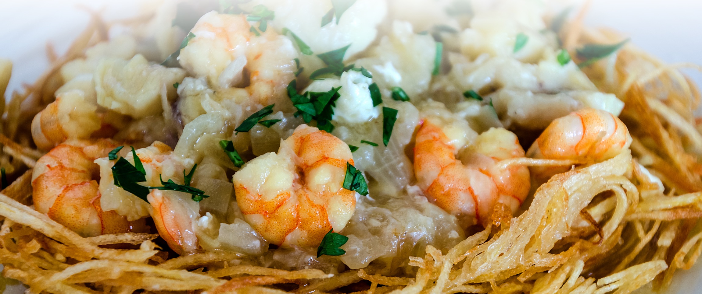 Shrimp on a Bed of Onion Straws