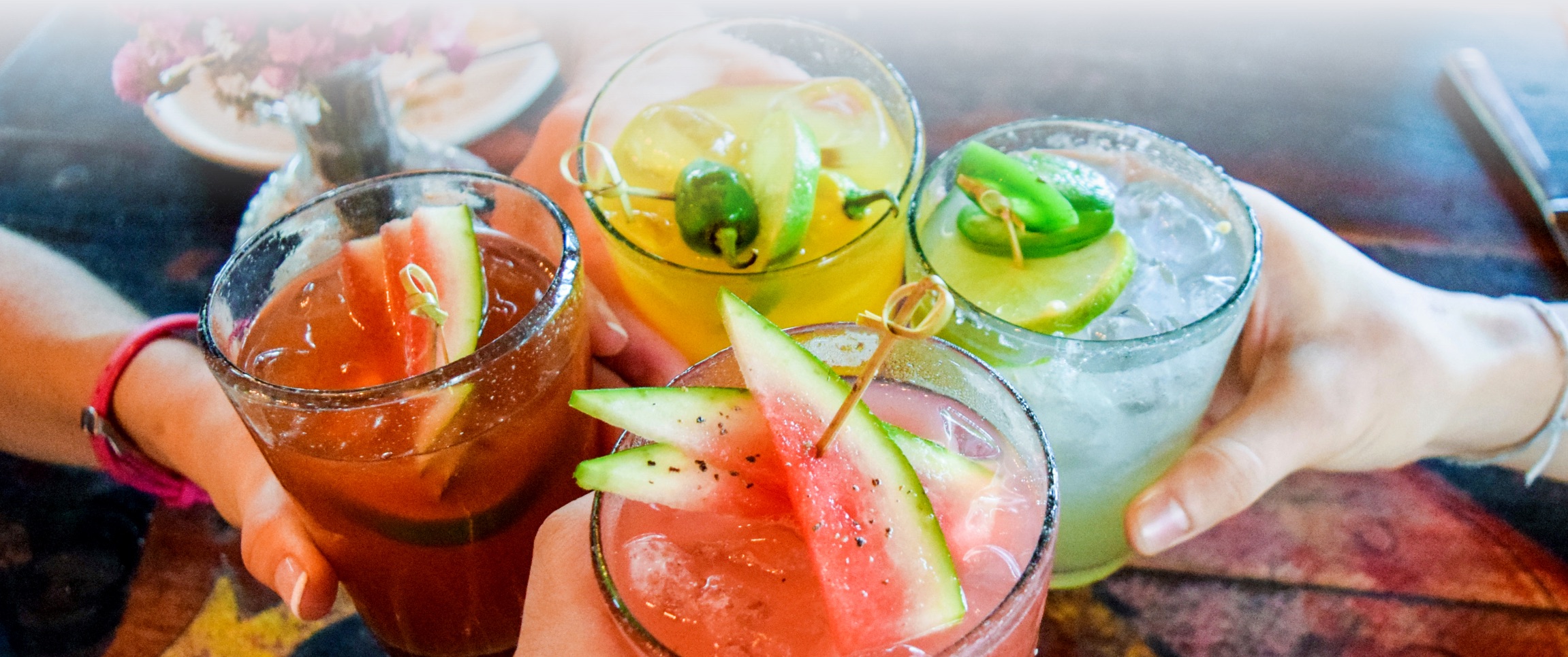 Group of people toasting cocktails