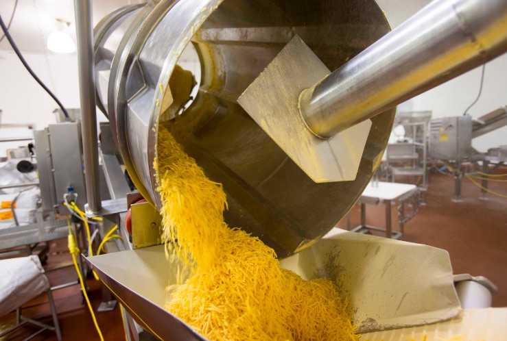 Cheese processing in a factory