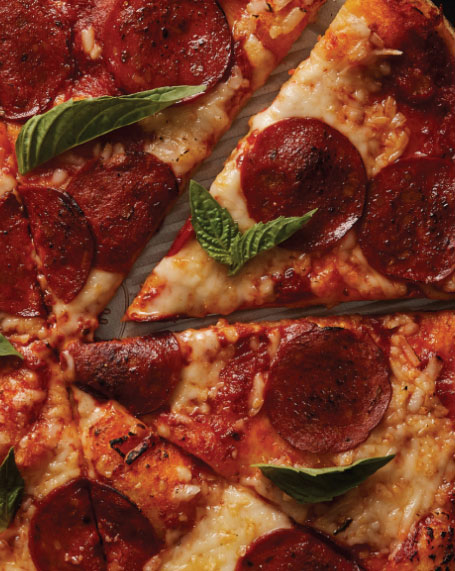 Pepperoni Pizza with Fresh Basil Leaves